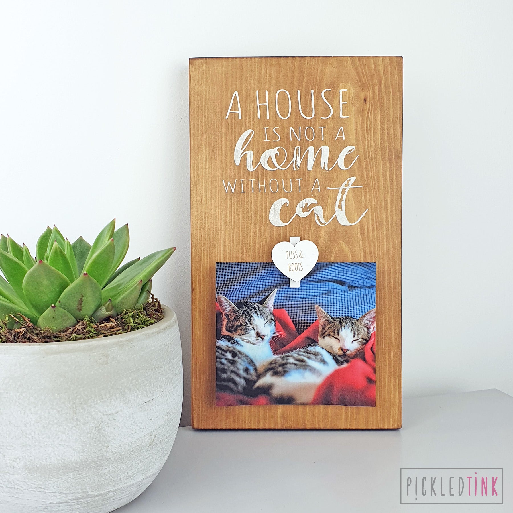 A house is not a home without a cat - Peg Photo Frame