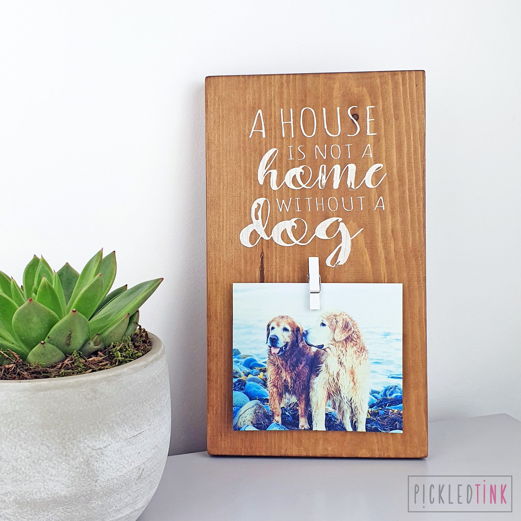 A house is not a home without a dog - Peg Photo Frame